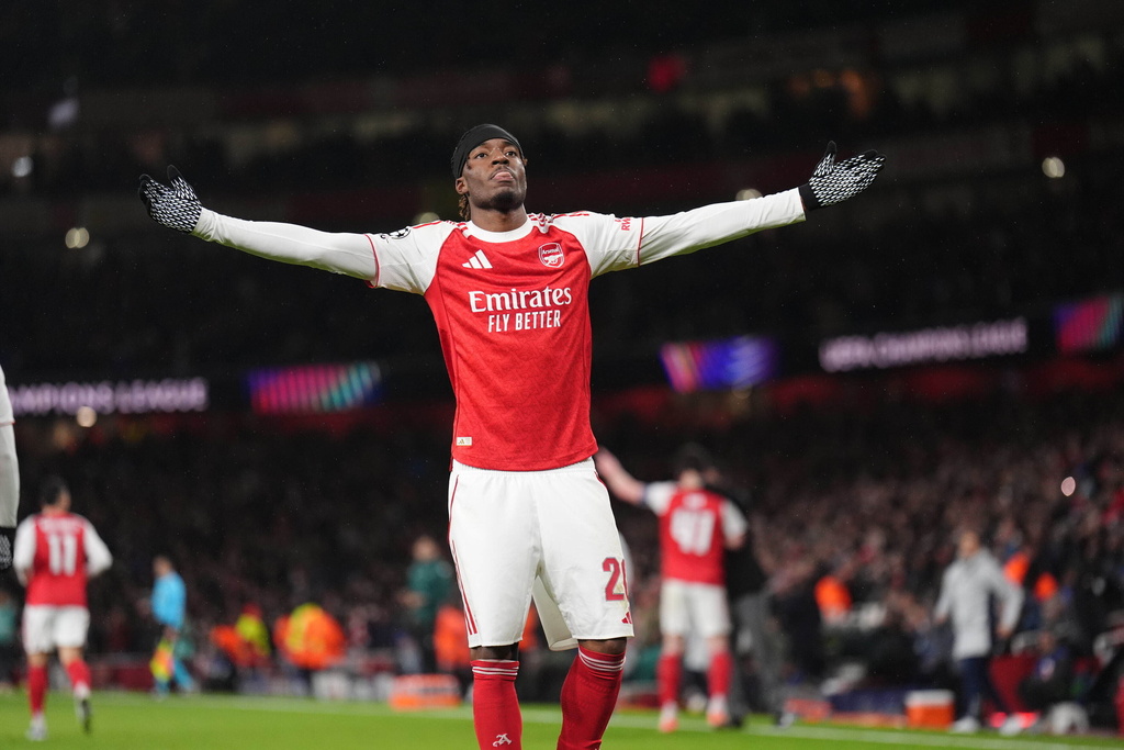 Arsenal's Noni Madueke celebrates after scoring his side's second goal during the Champions League opening phase soccer match between Arsenal and Bayern Munich in London, Wednesday, Nov. 26, 2025. (John Walton/PA via AP)