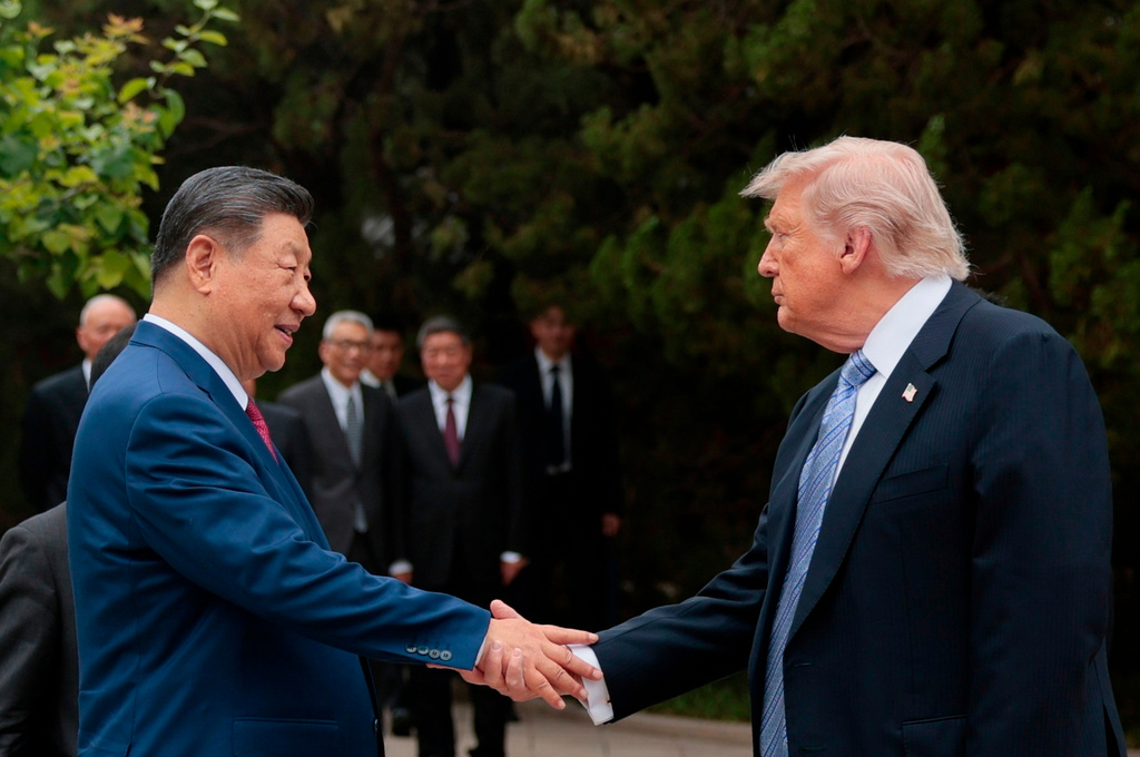 U.S. President Donald Trump, right, shakes hands with Chinese President Xi Jinping while leaving after a visit to the Zhongnanhai Garden in Beijing, Friday, May 15, 2026. (Evan Vucci/Pool Photo via AP)