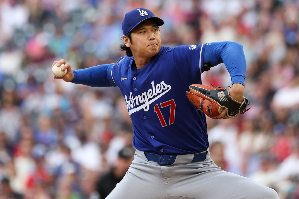 Los Angeles Dodgers starting pitcher Shohei Ohtani delivers against the Minnesota Twins during the first inning of a baseball game, Wednesday, June 24, 2026, in Minneapolis. (AP Photo/Matt Krohn)