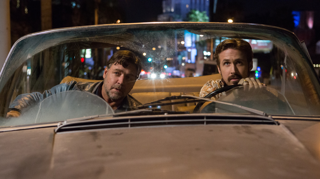 This image released by Warner Bros. shows Russell Crowe, left, and Ryan Gosling in a scene from "The Nice Guys." (Daniel McFadden/Warner Bros. via AP)