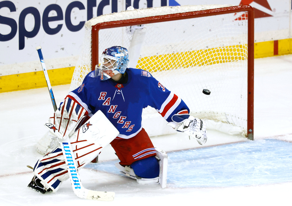 A puck shot by Anaheim Ducks left wing Cutter Gauthier (not shown) gets by New York Rangers goaltender Igor Shesterkin for a goal during the third period of an NHL hockey game, Monday, Dec 15, 2025, in New York. (AP Photo/Noah K. Murray)