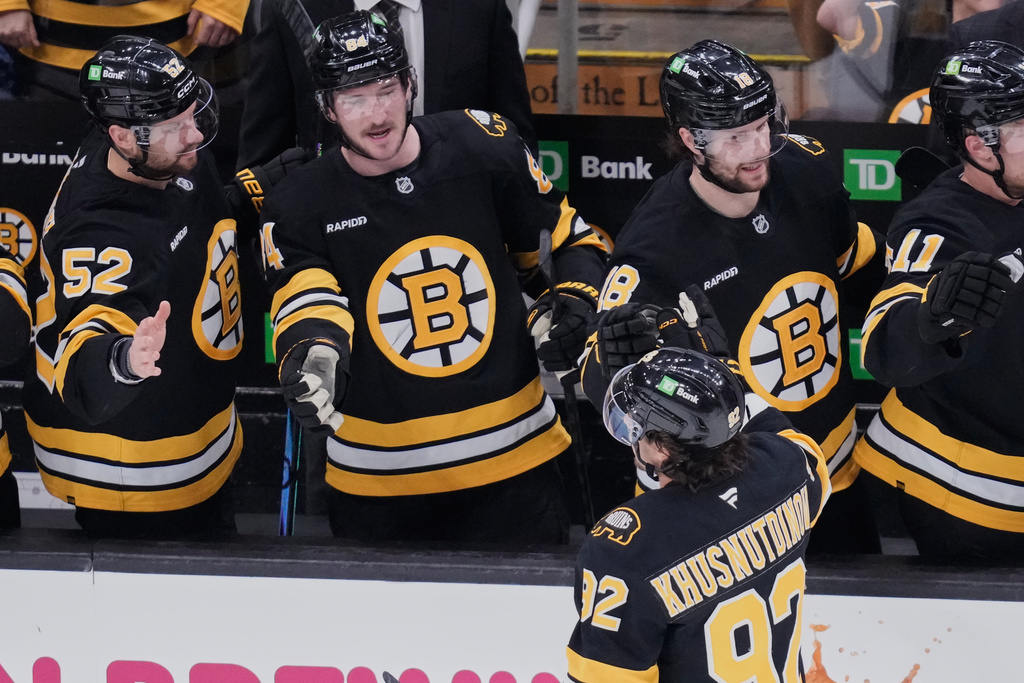 Boston Bruins center Marat Khusnutdinov (92) is congratulated after his goal against the Pittsburgh Penguins during the first period of an NHL hockey game, Tuesday, March 3, 2026, in Boston. (AP Photo/Charles Krupa)
