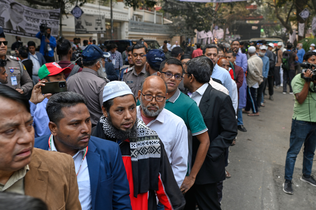 Voters wait in line outside a polling center to cast their ballots during the national parliamentary elections in Dhaka, Bangladesh, Thursday, Feb. 12, 2026. (AP Photo/Mahmud Hossain Opu)