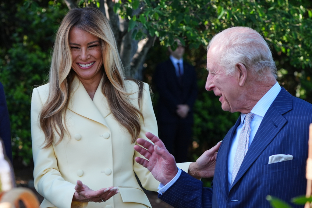 First lady Melania Trump and Britain's King Charles III talk during a tour of the White House garden and bee hive on the South Lawn of the White House, Monday, April 27, 2026, in Washington. (AP Photo/Alex Brandon, Pool)
