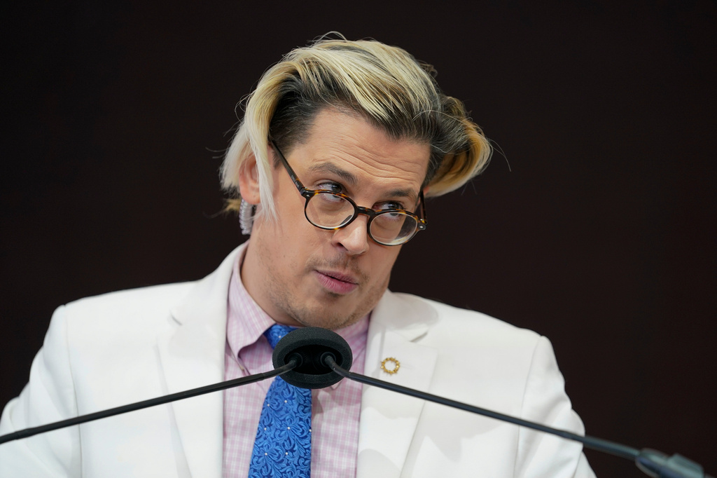 FILE - Activist Milo Yiannopoulos speaks during a rally outside of the Baltimore hotel where the United States Conference of Catholic Bishops are holding its Fall General Assembly meeting in Baltimore, Nov. 16, 2021. (AP Photo/Julio Cortez, File)