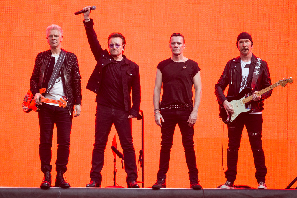 FILE - Adam Clayton, from left, Bono, Larry Mullen Jr. and The Edge, of the band U2, perform on stage at Twickenham Stadium in London on July 9, 2017. (Photo by Joel Ryan/Invision/AP, File)
