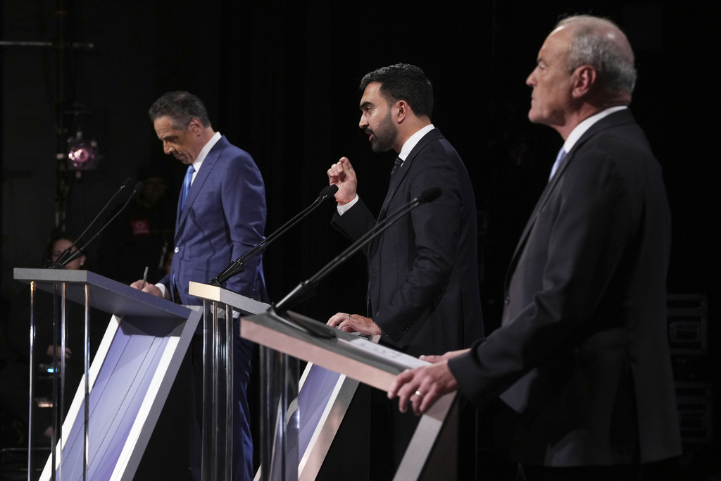 Independent candidate former New York Gov. Andrew Cuomo, Republican candidate Curtis Sliwa and Democratic candidate Assemblyman Zohran Mamdani participate in a second New York City mayoral debate at LaGuardia Performing Arts Center at LaGuardia Community College in the Queens borough of New York, Wednesday, Oct. 22, 2025. (Hiroko Masuike/The New York Times via AP, Pool)