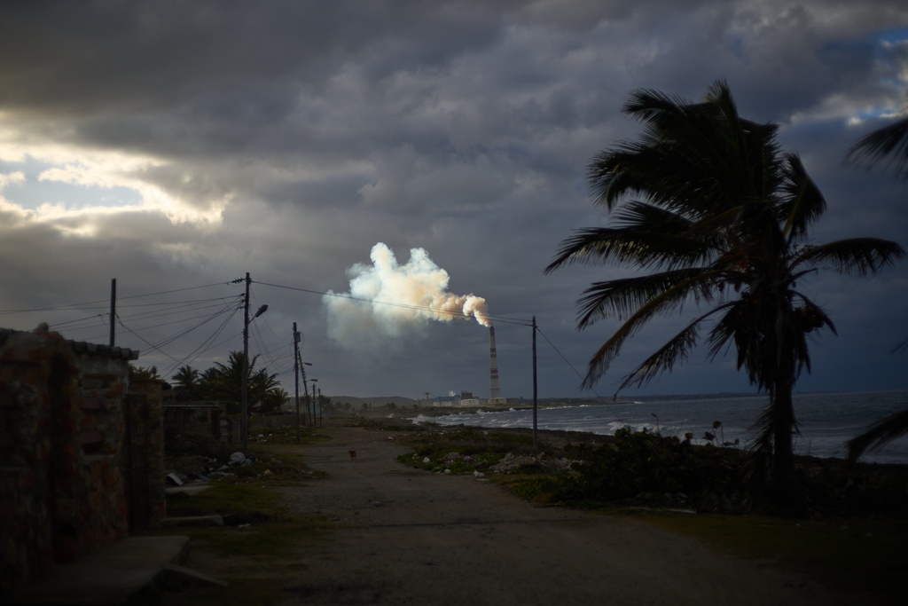 Smoke rises from the chimney of the Ernesto Guevara de la Serna thermoelectric plant in Santa Cruz del Norte, Cuba, at sunset Tuesday, Feb. 3, 2026. (AP Photo/Ramon Espinosa)