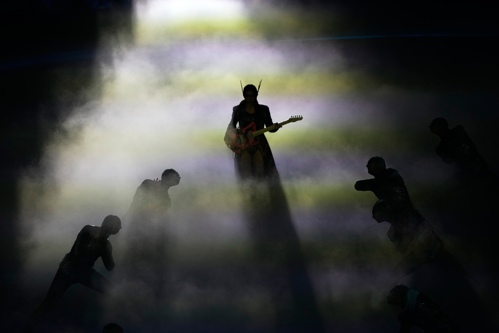 Artists perform during the closing ceremony of the 2026 Winter Olympics, in Verona, Italy, Sunday, Feb. 22, 2026. (AP Photo/Bernat Armangue)