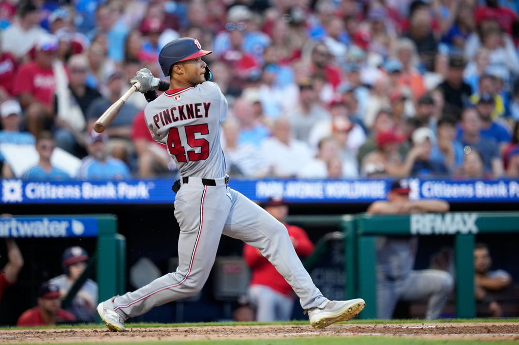 Washington Nationals' Andrew Pinckney follows through after hitting a home run against Philadelphia Phillies pitcher Cristopher Sánchez during the fourth inning of a baseball game Thursday, Aug. 6, 2026, in Philadelphia. (AP Photo/Matt Slocum)
