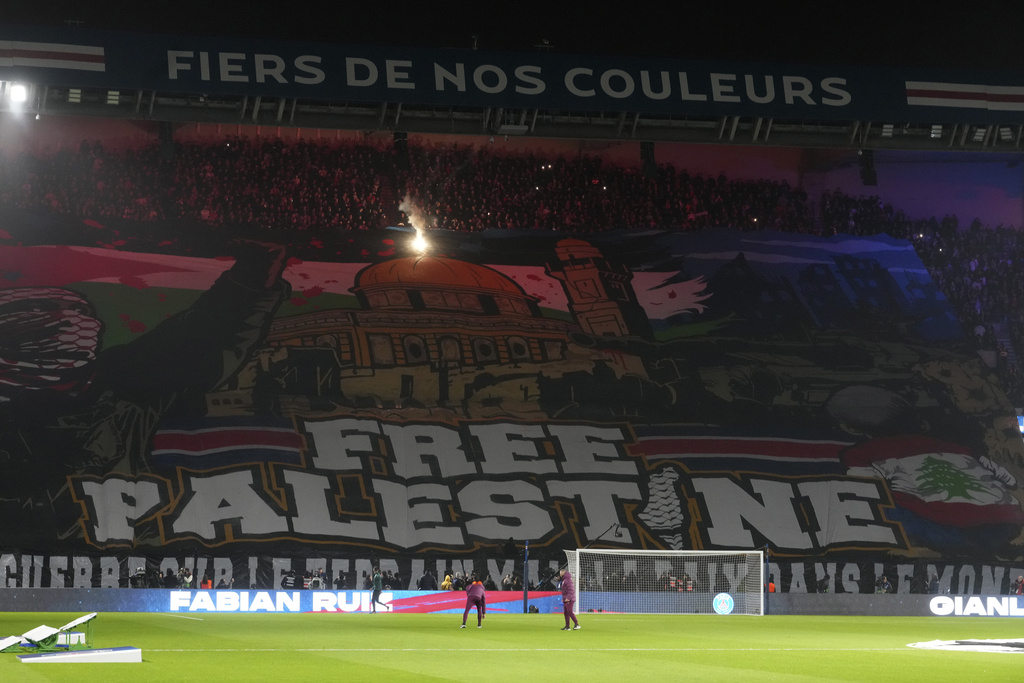 FILE - A giant banner reads "Free Palestine" is displayed before the Champions League opening phase soccer match between Paris Saint Germain and Atletico Madrid at the Parc des Princes stadium in Paris, Wednesday, Nov. 6, 2024. (AP Photo/Michel Euler, File)