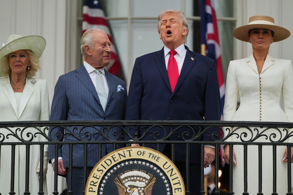 President Donald Trump and Britain's King Charles III laugh together while Queen Camilla, left, and first lady Melania Trump, right, watch an arrival ceremony on the South Lawn of the White House, Tuesday, April 28, 2026, in Washington. (AP Photo/Julia Demaree Nikhinson)