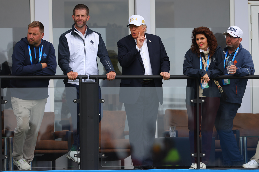 U.S. President Donald Trump and son Eric Trump watch the play during the Irish Open at the Trump International Golf Links course in Doonbeg, Ireland, Saturday, Sept. 12, 2026.(AP Photo/Peter Morrison)