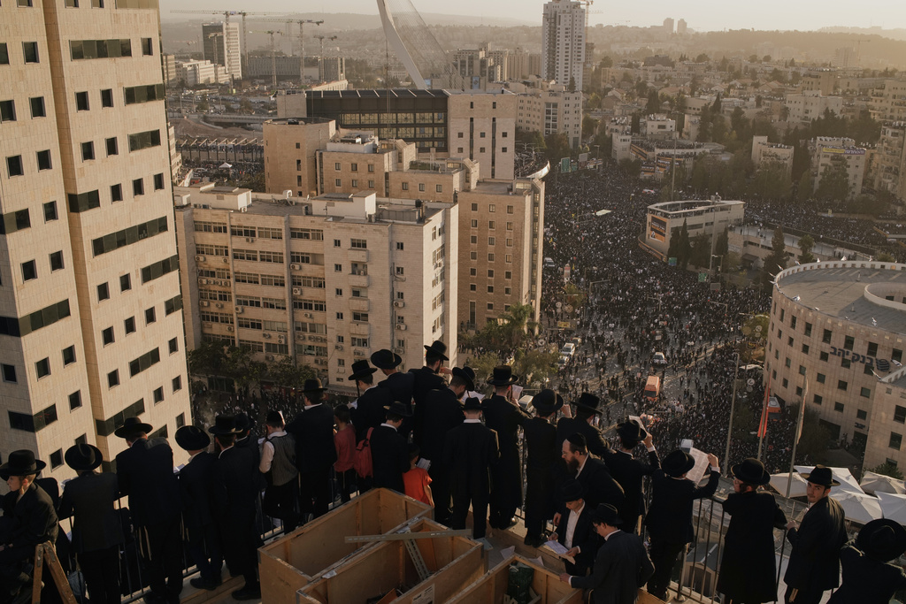 Ultra-Orthodox Jewish men attend a rally against plans to force them to serve in the Israeli military, in Jerusalem, Thursday, Oct. 30, 2025. (AP Photo/Leo Correa)