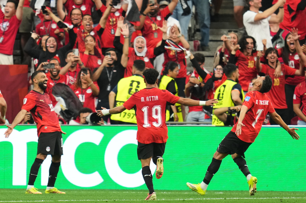 Egypt's Trezeguet (7) celebrates with Mohamed Salah (10) and Marawan Attia (19) after scoring his side's third goal during the World Cup Group G soccer match between New Zealand and Egypt in Vancouver, British Columbia, Sunday, June 21, 2026. (AP Photo/Abbie Parr)