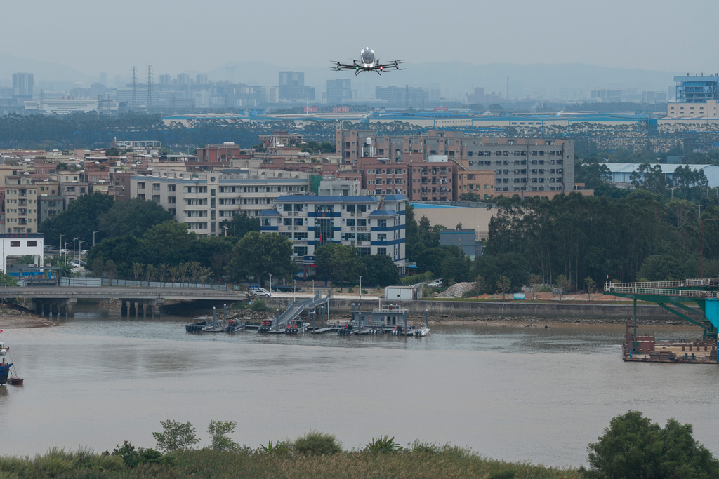 The EHang eVTOL EH126-S takes to the sky in Guangzhou in southern China's Guangdong province on Monday, Nov. 3, 2025. (AP Photo/Ng Han Guan)