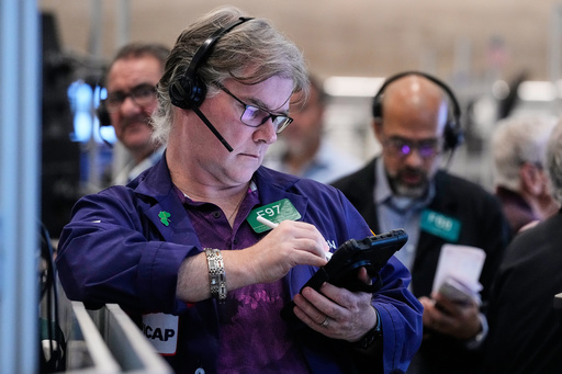 Options trader Brian Garvey, left, works on the floor of the New York Stock Exchange, Monday, Oct. 20, 2025. (AP Photo/Richard Drew) Options trader Brian Garvey, left, works on the floor of the New York Stock Exchange, Monday, Oct. 20, 2025. (AP Photo/Richard Drew)