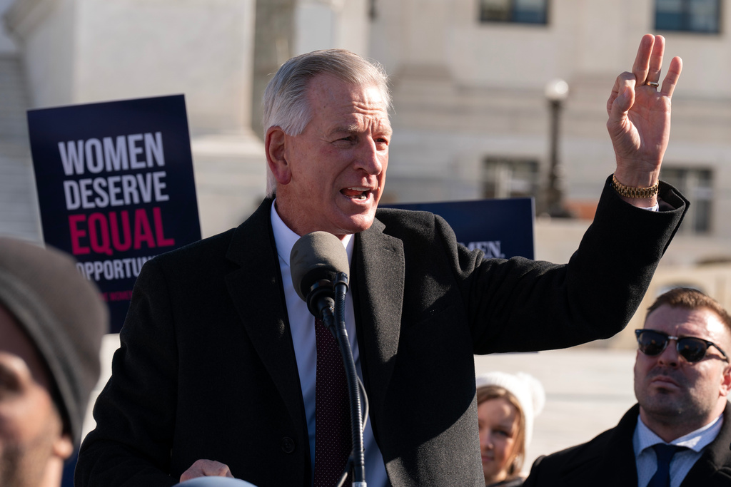 Sen. Tommy Tuberville, R-Ala., speaks to the crowd as protesters gather outside the Supreme Court as it hears arguments over state laws barring transgender girls and women from playing on school athletic teams, Tuesday, Jan. 13, 2026, in Washington. (AP Photo/Jose Luis Magana)