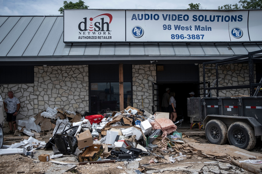 Flood debris and damage is visible at Audio Video Solutions on Friday, July 17, 2026, in Kerrville, Texas. (AP Photo/Joel Angel Juarez)