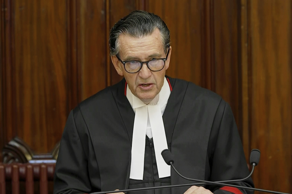In this image made from video, Justice Christopher Beale addresses the court as he reads the sentencing for triple-murderer Erin Patterson at the Supreme Court of Victoria in Melbourne, Australia, Monday, Sept. 8, 2025. (AuBC/Pool via AP)