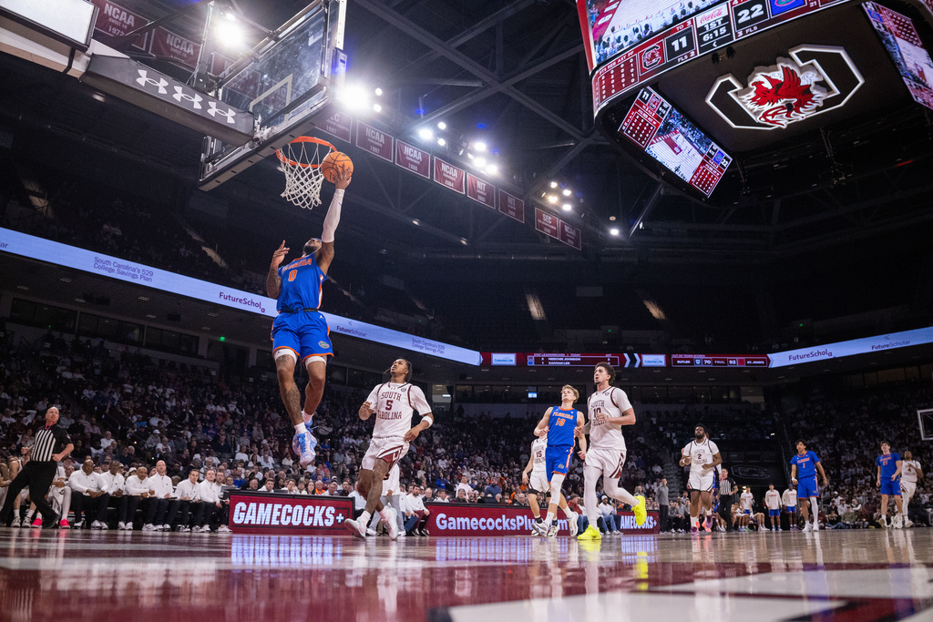 Florida Gators guard Boogie Fland (0) scores on a breakaway during the first half against the South Carolina in an NCAA college basketball game Wednesday, Jan. 28, 2026, in Columbia, S.C. (AP Photo/Scott Kinser)