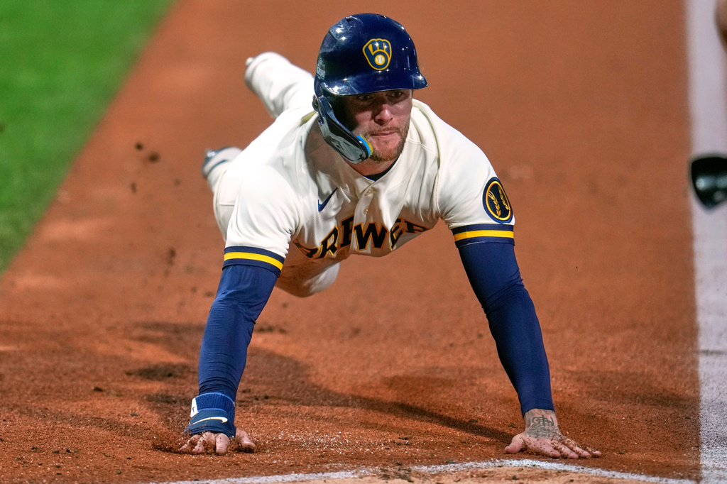 Milwaukee Brewers' Brice Turang scores on a double by Jake Bauers off Atlanta Braves pitcher Tyler Mahle during the third inning of the Little League Classic baseball game in Williamsport, Pa., Sunday, Aug. 23, 2026. (AP Photo/Gene J. Puskar)