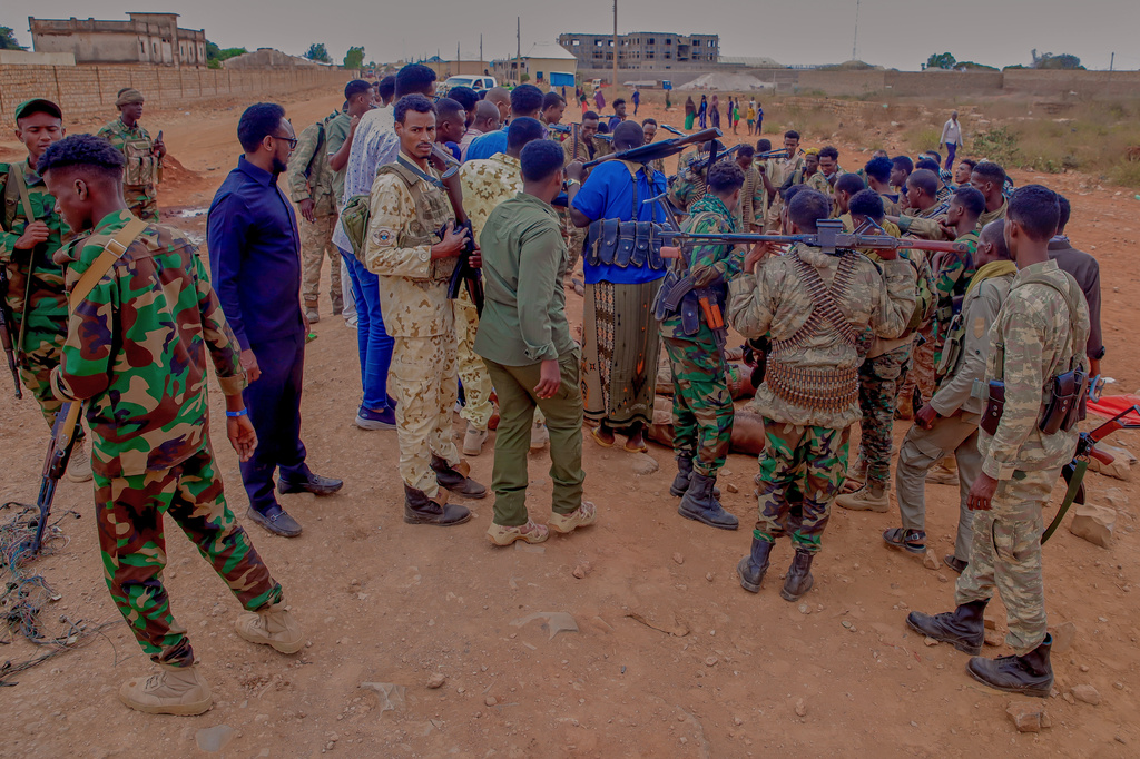Government troops check the bodies of militia members following clashes in Baidoa, Somalia, Monday, Aug. 17, 2026. (AP Photo)