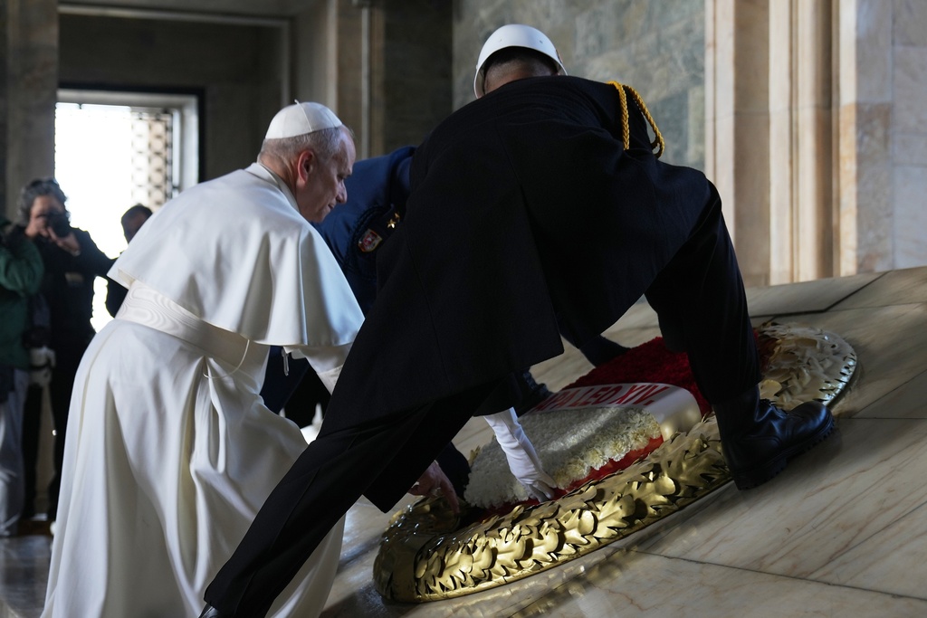 Pope Leo XIV poses a wreath at the Ataturk Mausoleum in Ankara, Turkey, Thursday, Nov. 27, 2025. (AP Photo/Domenico Stinellis)