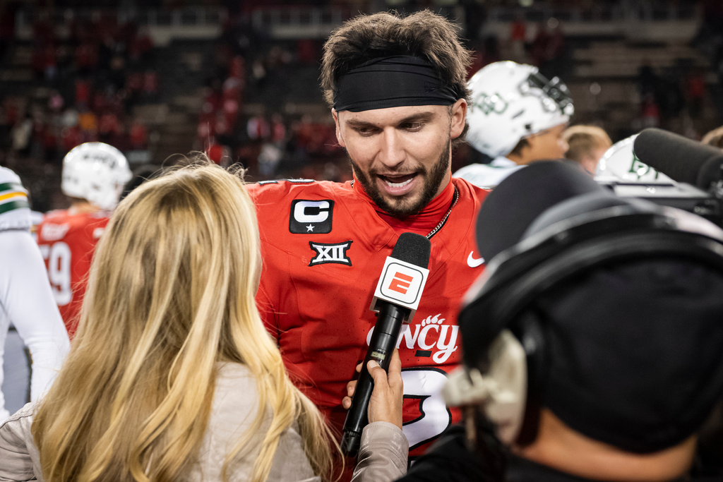 FILE - Cincinnati quarterback Brendan Sorsby (2) is interviewed after a NCAA college football game against Baylor, Saturday, Oct. 25, 2025, in Cincinnati. (AP Photo/Tanner Pearson,File)