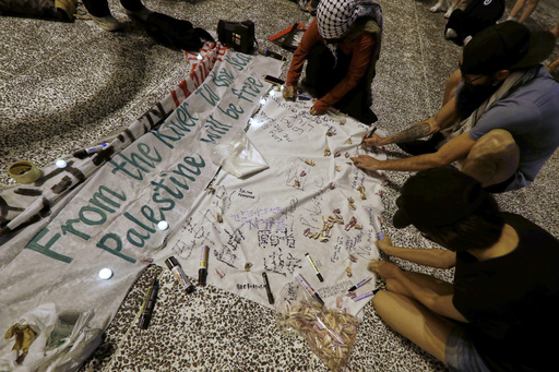 Pro-Palestinian protesters sign and make paper cranes during a candlelight vigil in support of Palestinians, in Taipei, Taiwan, Tuesday, Oct. 7, 2025. (AP Photo/Chiang Ying-ying) Pro-Palestinian protesters sign and make paper cranes during a candlelight vigil in support of Palestinians, in Taipei, Taiwan, Tuesday, Oct. 7, 2025. (AP Photo/Chiang Ying-ying)