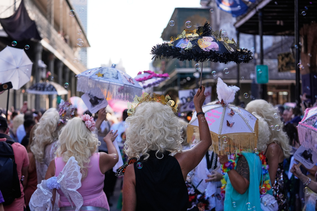 Members of the Krewe of Dolly lead a second line parade in commemoration of the life of Dolly Parton through the French Quarter Friday, Sept. 25, 2026, in New Orleans. (AP Photo/Gerald Herbert)