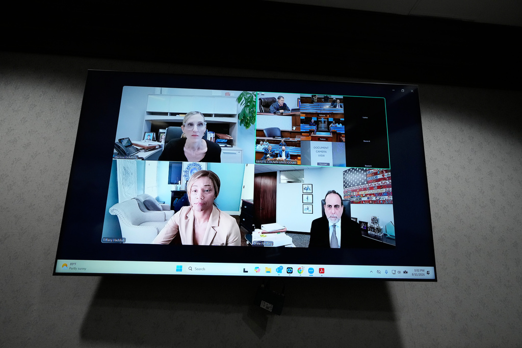 Comedian and actor Tiffany Haddish, along with her attorneys, appears via Zoom for her DUI trial Tuesday, Aug. 11, 2026, in Fayetteville, Ga. (AP Photo/Brynn Anderson)