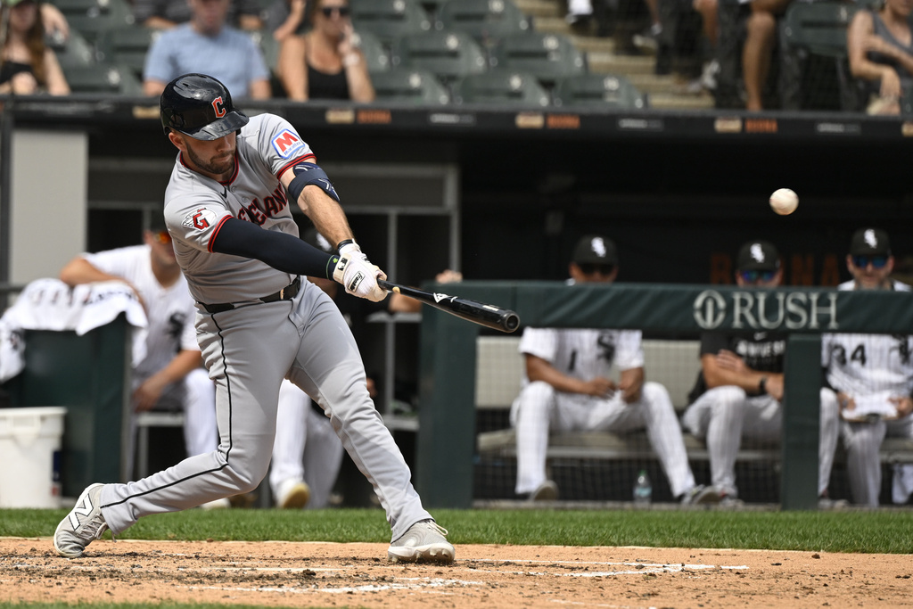 Cleveland Guardians' David Fry hits an RBI double during the sixth inning of a baseball game against the Chicago White Sox, Sunday, Aug. 10, 2025, in Chicago. (AP Photo/Matt Marton)