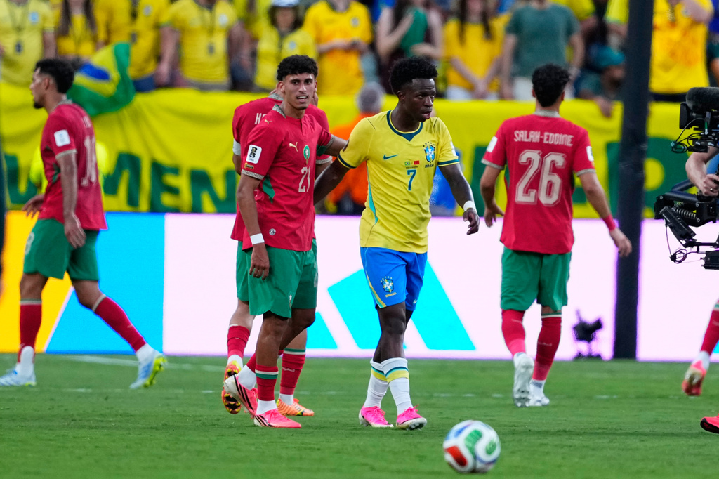 Brazil's Vinicius Junior, right, greats Morocco's Ayoub Amaimouni at the end of the World Cup Group C soccer match between Brazil and Morocco in East Rutherford, N.J., near New York, Saturday, June 13, 2026. (AP Photo/Petr David Josek)