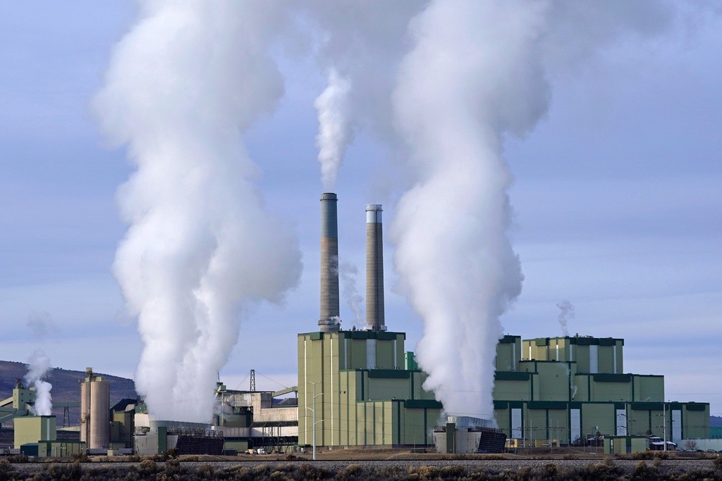 FILE - Craig Power Plant, a coal-fired power plant, operates Nov. 18, 2021, in Craig, Colo. (AP Photo/Rick Bowmer, File)