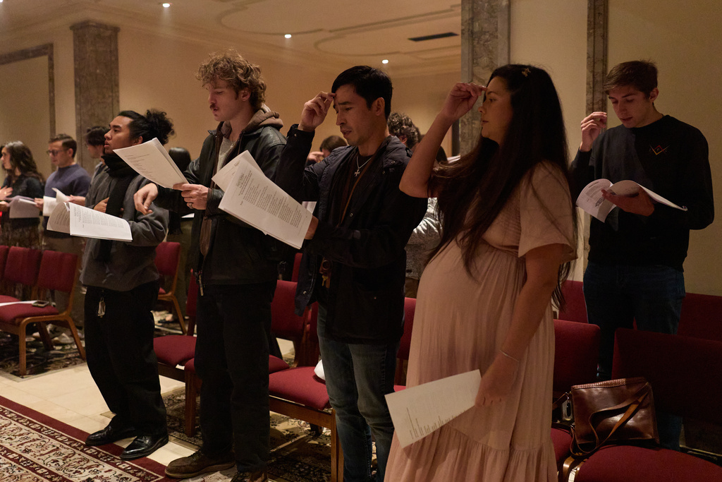 People sing and pray during service at St. Sophia Greek Orthodox Cathedral Tuesday, Nov. 18, 2025, in Los Angeles. (AP Photo/Allison Dinner)