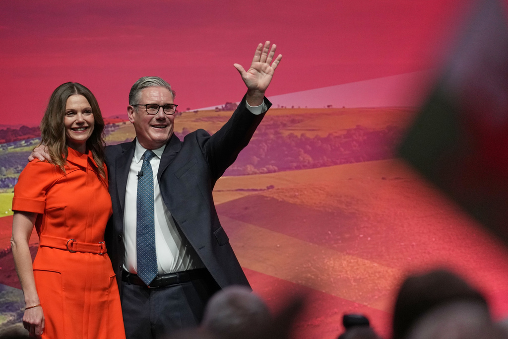 Britain's Prime Minister Keir Starmer and his wife Victoria wave to the delegates and audience after he gave his keynote speech at the annual Labour Party conference in Liverpool, England, Tuesday, Sept. 30, 2025. (AP Photo/Jon Super)