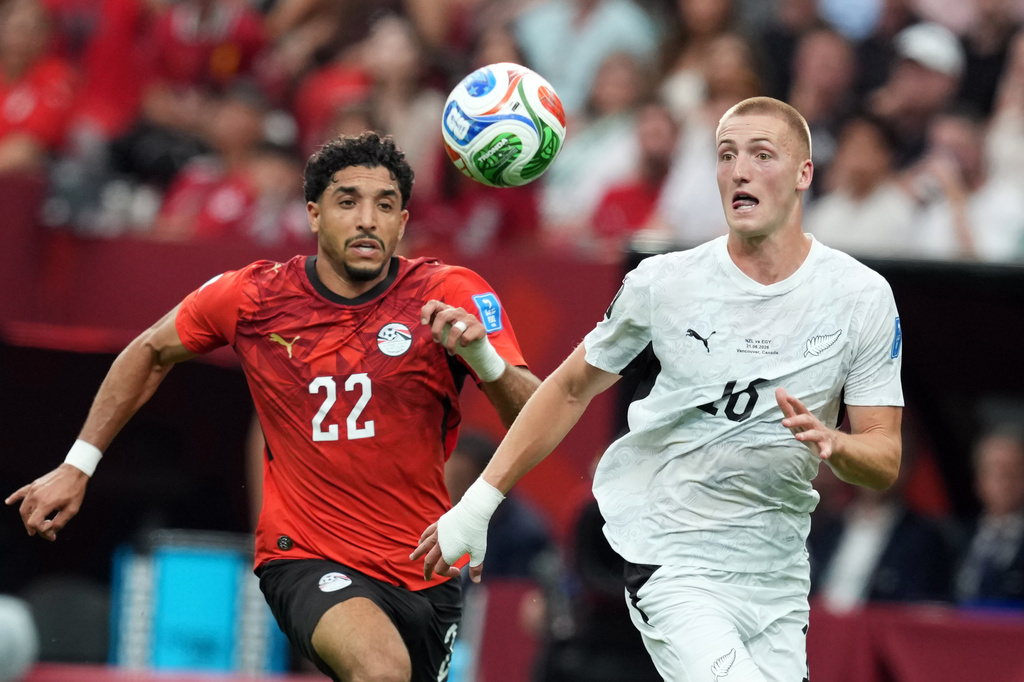Egypt's Omar Marmoush (22) and New Zealand's Finn Surman, right, vie for the ball during the first half of a World Cup Group G soccer match in Vancouver, British Columbia, Sunday, June 21, 2026. (Ethan Cairns/The Canadian Press via AP)