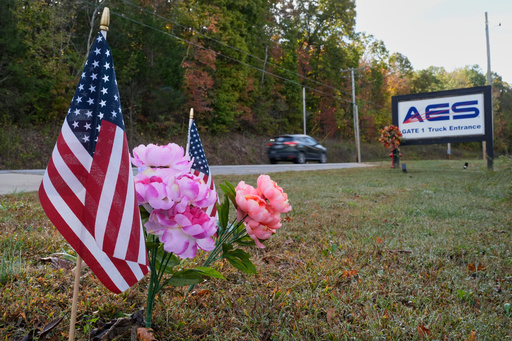 Flags and flowers are seen at the entrance to Accurate Energetic Systems Friday, Oct. 24, 2025, after an explosion killed 16 people on Oct. 10, in McEwen, Tenn. (AP Photo/George Walker IV) Flags and flowers are seen at the entrance to Accurate Energetic Systems Friday, Oct. 24, 2025, after an explosion killed 16 people on Oct. 10, in McEwen, Tenn. (AP Photo/George Walker IV)