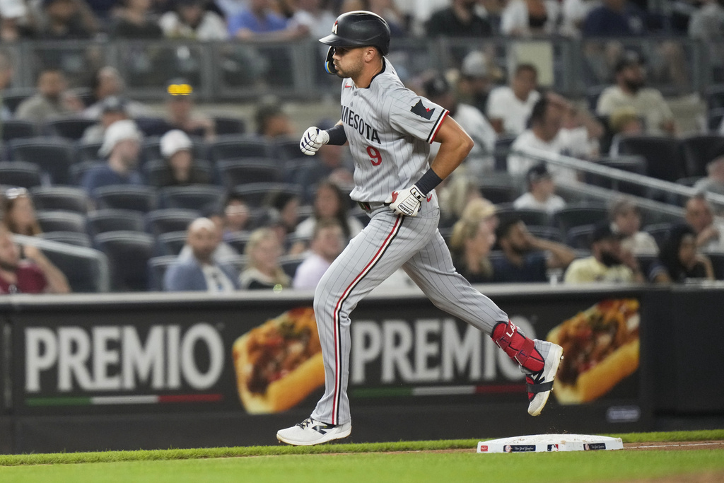 Minnesota Twins' Trevor Larnach (9) runs the bases after hitting a home run during the seventh inning of a baseball game against the New York Yankees Monday, Aug. 11, 2025, in New York. (AP Photo/Frank Franklin II)