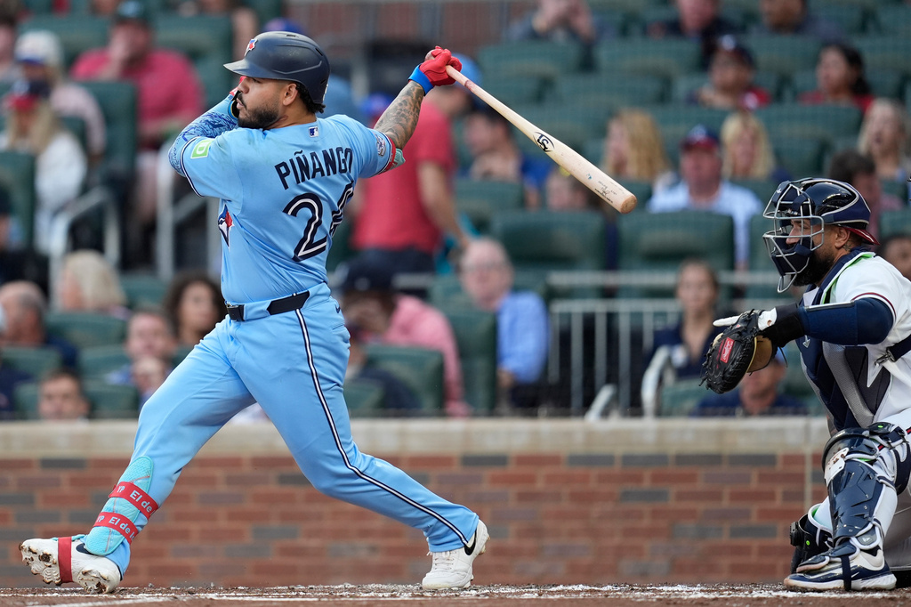 Toronto Blue Jays left fielder Yohendrick Piñango (24) hits a single against the Atlanta Braves in the second inning of a baseball game, Tuesday, June 2, 2026, in Atlanta. (AP Photo/Mike Stewart)