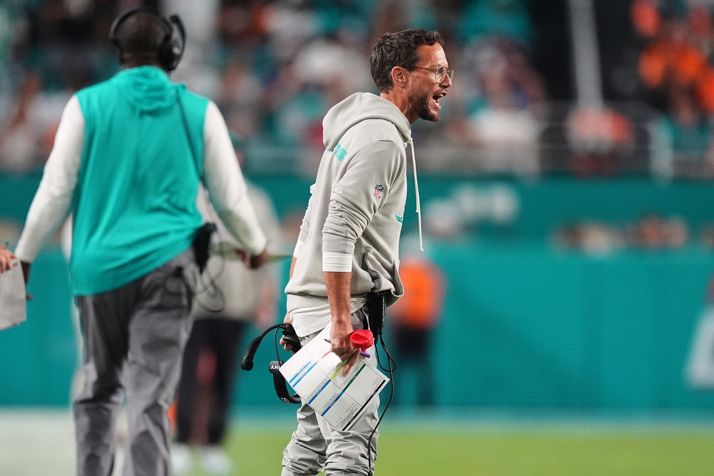 Miami Dolphins head coach Mike McDaniel reacts during the first half of an NFL football game against the Baltimore Ravens, Thursday, Oct. 30, 2025, in Miami Gardens, Fla. (AP Photo/Rebecca Blackwell)