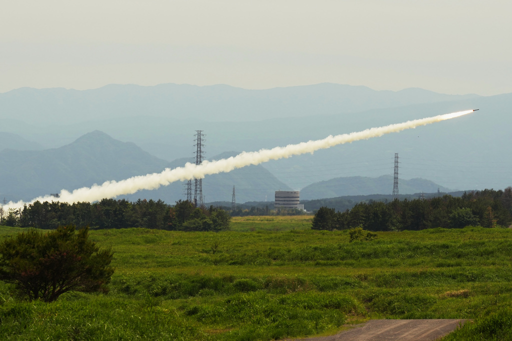 U.S. Marines conduct a live-fire training of the High Mobility Artillery Rocket System (HIMARS) during a media tour at Camp Fuji, in Gotemba, southwest of Tokyo, Wednesday, May 20, 2026. (AP Photo/Hiro Komae)