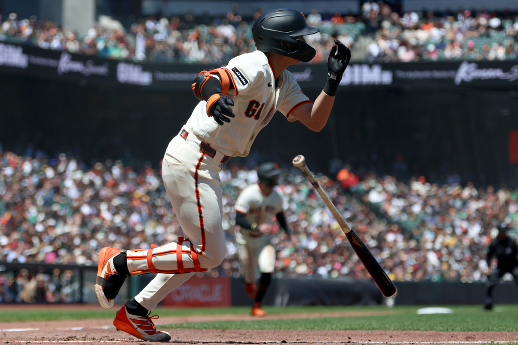 San Francisco Giants' Jung Hoo Lee watches his three-run triple against the Athletics during the sixth inning of a baseball game in San Francisco, Thursday, June 25, 2026. (AP Photo/Jed Jacobsohn)