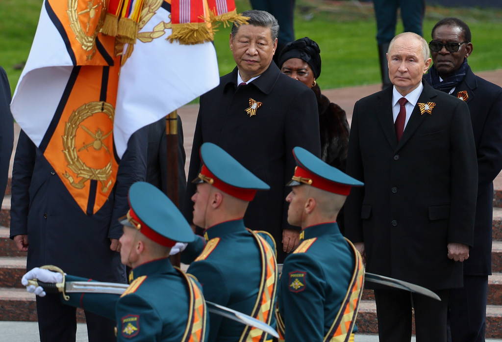 Chinese President Xi Jinping, centre, and Russian President Vladimir Putin, second from right, attend a wreath laying ceremony at the Tomb of the Unknown Soldier in Alexander Garden after the Victory Day military parade in Moscow, Russia, Friday, May 9, 2025, during celebrations of the 80th anniversary of the Soviet Union's victory over Nazi Germany during the World War II. (Yuri Kochetkov/Pool Photo via AP, File)