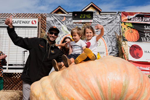 From left, Brandon Dawson celebrates with his children Roman and Ayla after winning the Safeway 52nd annual World Championship Pumpkin Weigh-Off in Half Moon Bay, Calif., Monday, Oct. 13, 2025. (AP Photo/Godofredo A. Vásquez) From left, Brandon Dawson celebrates with his children Roman and Ayla after winning the Safeway 52nd annual World Championship Pumpkin Weigh-Off in Half Moon Bay, Calif., Monday, Oct. 13, 2025. (AP Photo/Godofredo A. Vásquez)
