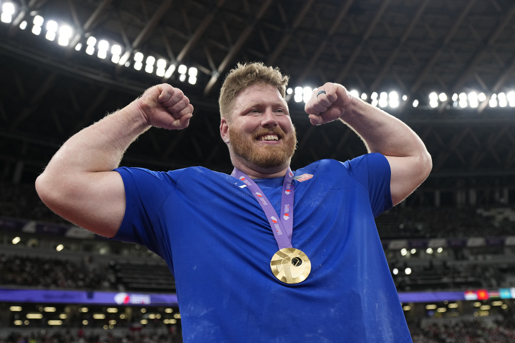 United States' Ryan Crouser celebrates after winning the gold medal in the men's shot put final at the World Athletics Championships in Tokyo, Saturday, Sept. 13, 2025. (AP Photo/Ashley Landis)