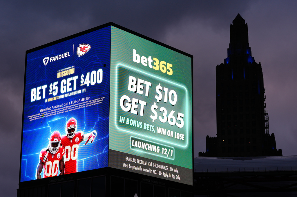 Advertisements for sports betting apps are seen in downtown Kansas City, Mo., Saturday, Nov. 29, 2025. (AP Photo/Charlie Riedel)