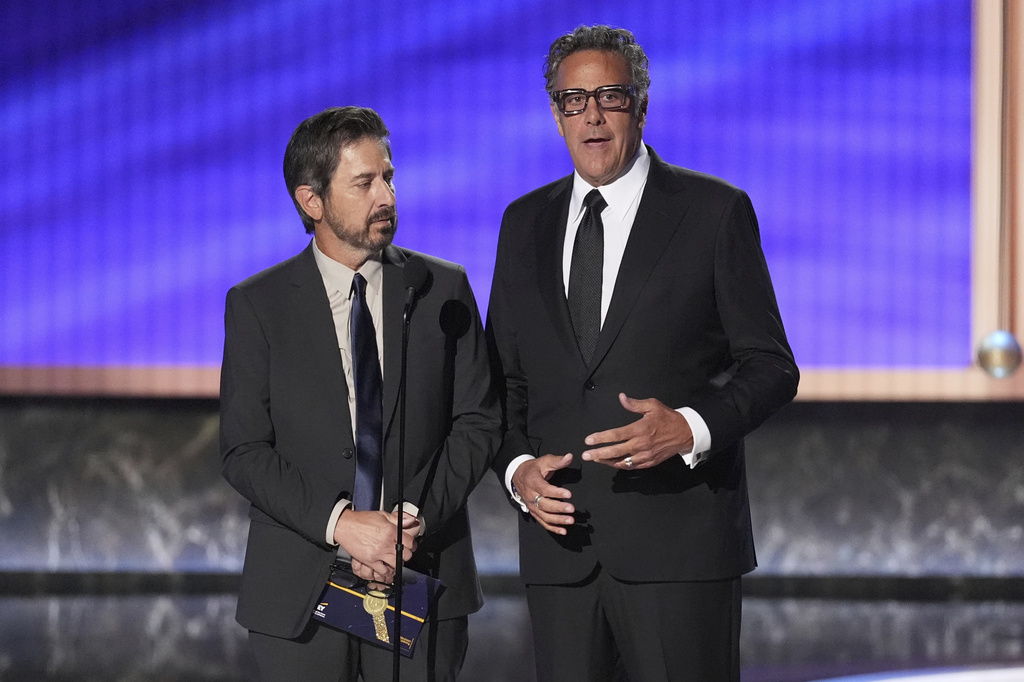 Ray Romano, left, and Brad Garrett present the award for outstanding comedy series during the 77th Primetime Emmy Awards on Sunday, Sept. 14, 2025, at the Peacock Theater in Los Angeles. (AP Photo/Chris Pizzello)