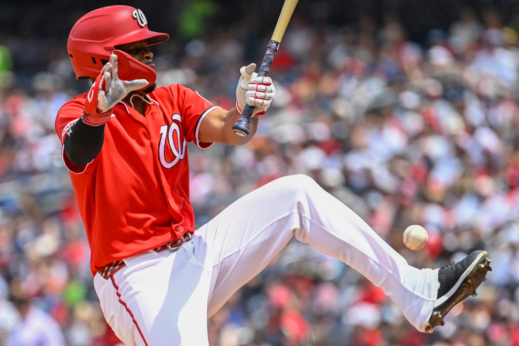 Washington Nationals' Jorbit Vivas is hit by a pitch from New York Yankees' Will Warren during the second inning of a baseball game, Sunday July 12, 2026, in Washington. (AP Photo/John McDonnell)